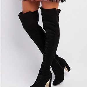Thigh high black lace-up boots
